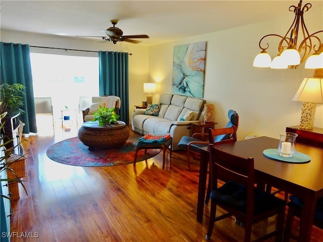 living area with a ceiling fan and wood finished floors