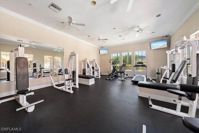 gym with visible vents, crown molding, and baseboards