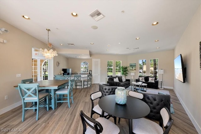 dining room featuring wood finished floors, recessed lighting, baseboards, and visible vents