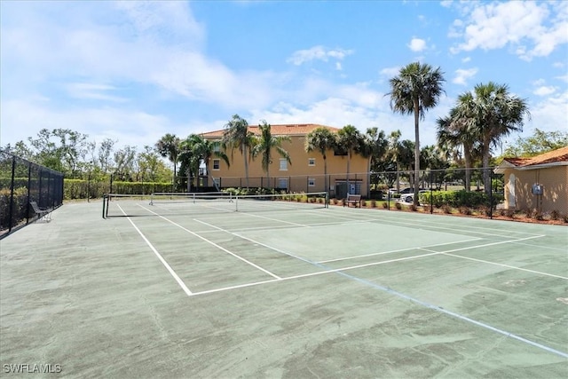 view of sport court with fence