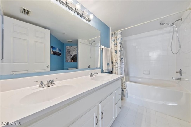 full bath featuring double vanity, visible vents, shower / tub combo with curtain, and a sink