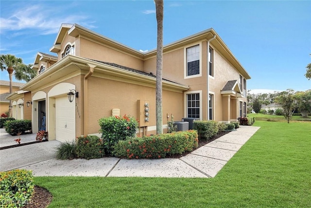 view of side of home featuring a yard and stucco siding