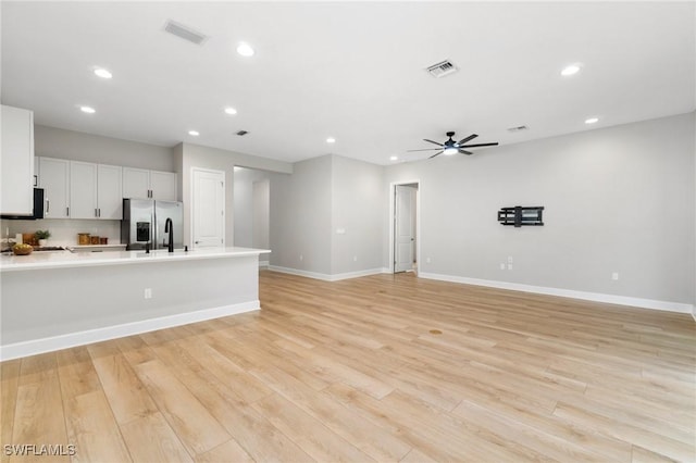 interior space with recessed lighting, visible vents, and light wood-style flooring