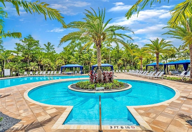 pool featuring a patio area, fence, and a gazebo