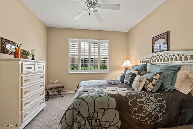 carpeted bedroom with baseboards and ceiling fan