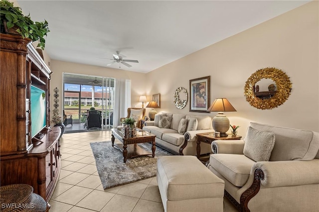 living area with light tile patterned flooring and ceiling fan