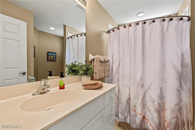 bathroom featuring recessed lighting, visible vents, curtained shower, and vanity