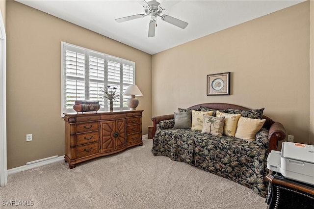 bedroom with carpet flooring, a ceiling fan, and baseboards