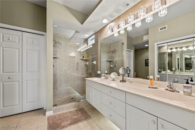 full bath featuring visible vents, a stall shower, and a sink