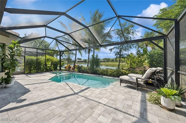 3171 Quilcene Ln, Naples, FL 34114 - view of swimming pool featuring a patio area, a water view, glass enclosure, and a pool with connected hot tub