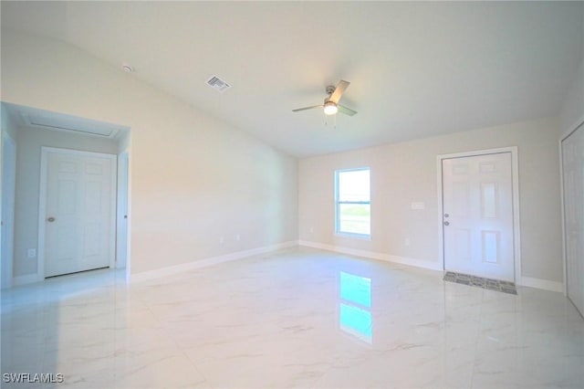 empty room featuring marble finish floor, visible vents, ceiling fan, and baseboards