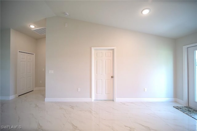 spare room with marble finish floor, recessed lighting, visible vents, vaulted ceiling, and baseboards