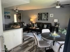 dining room with wood finished floors and ceiling fan