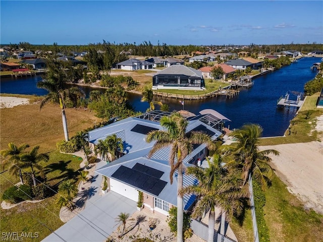 bird's eye view featuring a water view and a residential view