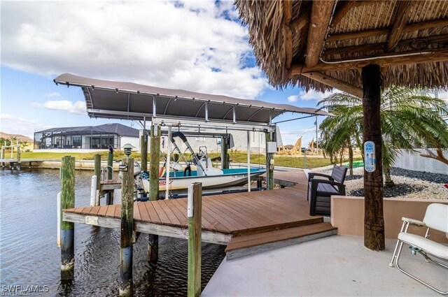 view of dock with a water view and boat lift