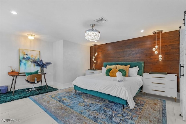 tiled bedroom featuring baseboards, wooden walls, visible vents, and recessed lighting