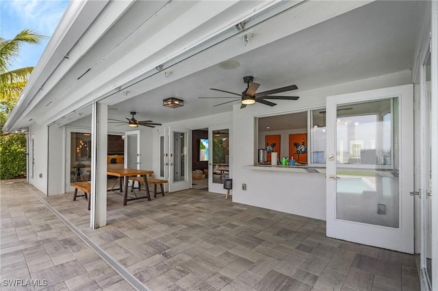 view of patio with a ceiling fan and french doors