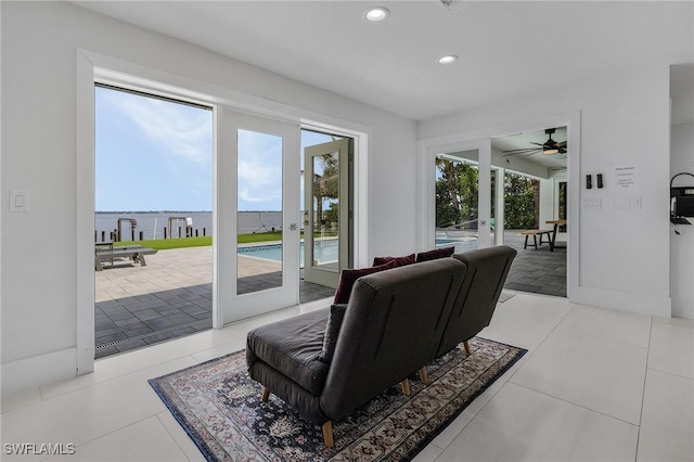 living room with baseboards, french doors, tile patterned floors, and recessed lighting