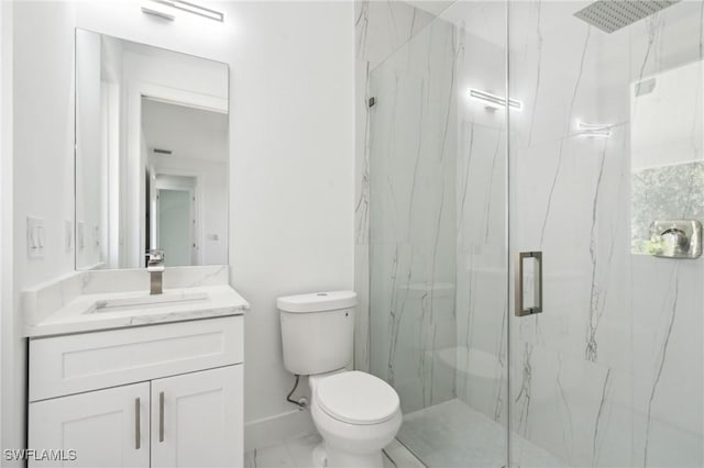 bathroom featuring a marble finish shower, baseboards, toilet, marble finish floor, and vanity