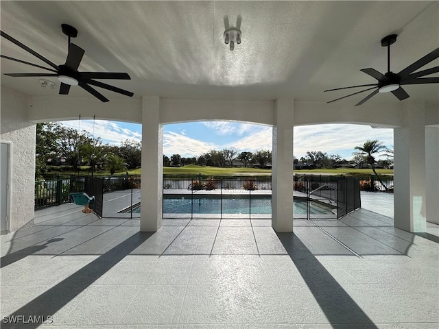 view of pool featuring a fenced in pool, a patio, and a ceiling fan