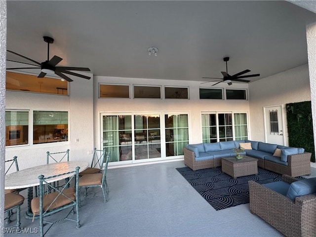 view of patio featuring outdoor dining space, outdoor lounge area, and a ceiling fan