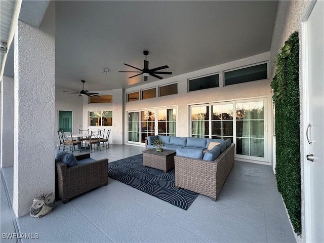 view of patio / terrace with outdoor dining space, outdoor lounge area, and ceiling fan