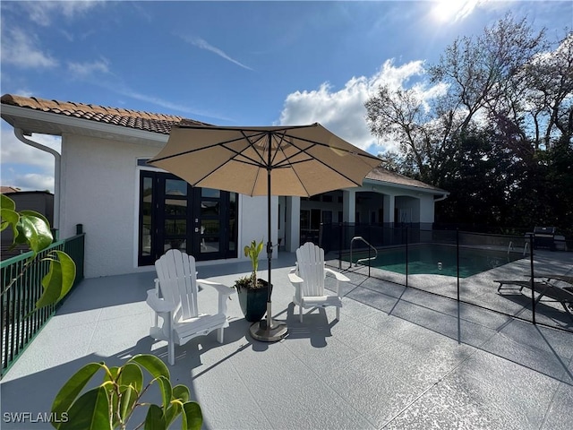 view of patio / terrace with fence and a fenced in pool