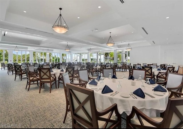 carpeted dining room featuring recessed lighting and a tray ceiling