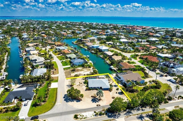 aerial view featuring a residential view and a water view