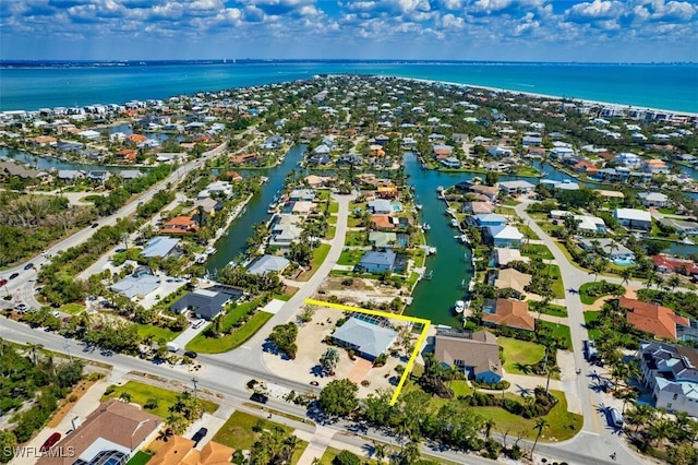 aerial view with a residential view and a water view