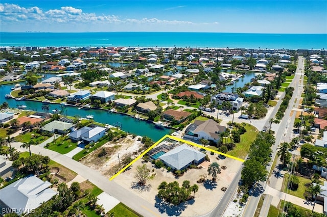 bird's eye view featuring a residential view and a water view