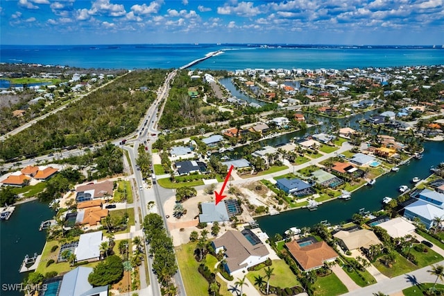 drone / aerial view featuring a water view and a residential view