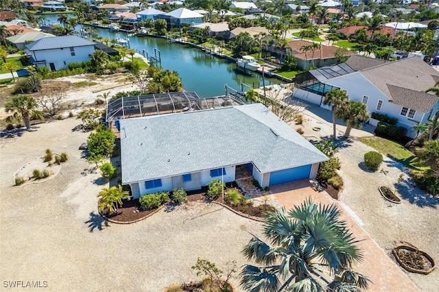 bird's eye view with a residential view and a water view