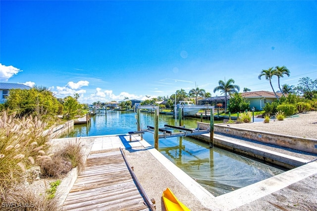 view of dock with a water view and boat lift