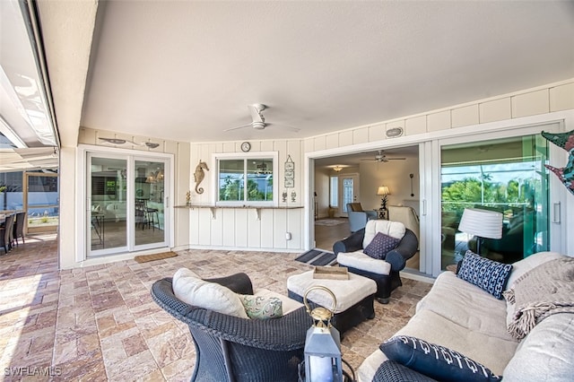 view of patio with a ceiling fan and outdoor lounge area