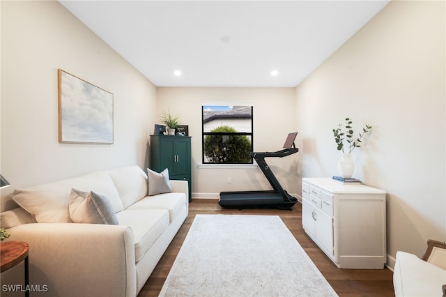 interior space with baseboards, dark wood finished floors, and recessed lighting