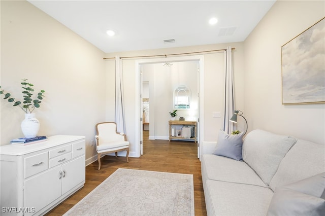 interior space featuring recessed lighting, wood finished floors, visible vents, and baseboards