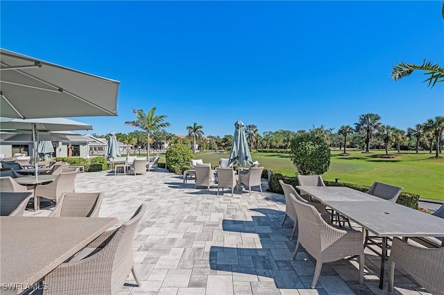 view of patio featuring outdoor dining area