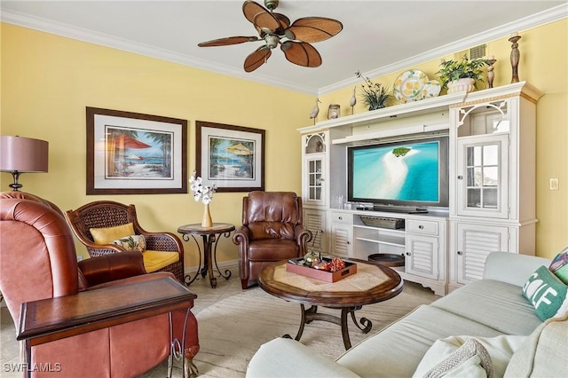 sitting room featuring ornamental molding, ceiling fan, and baseboards