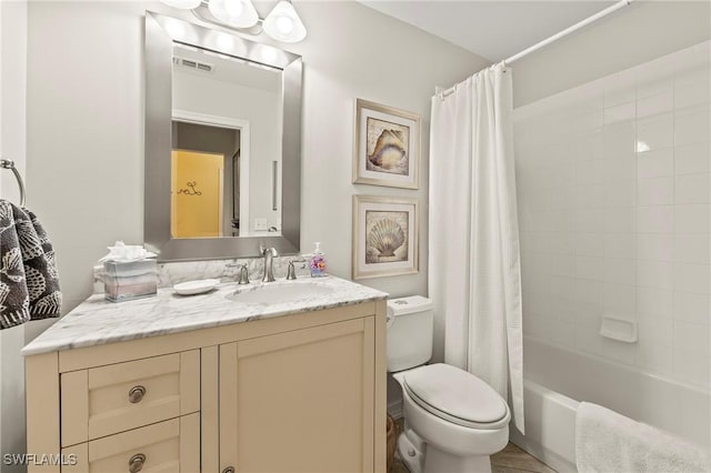 full bathroom with toilet, shower / tub combo, vanity, and visible vents