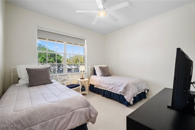 carpeted bedroom featuring a ceiling fan