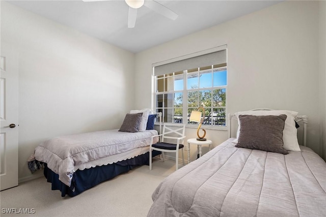 carpeted bedroom with a ceiling fan