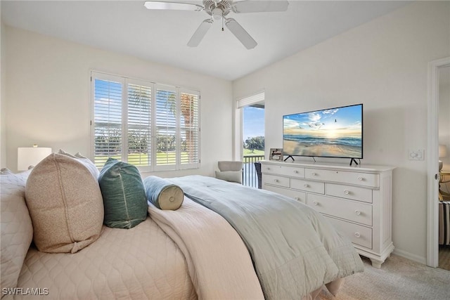 bedroom with ceiling fan, baseboards, and light colored carpet