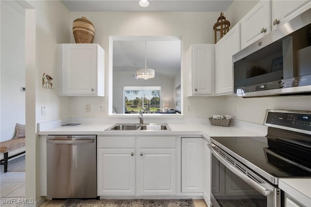 kitchen with white cabinets, stainless steel appliances, and a sink