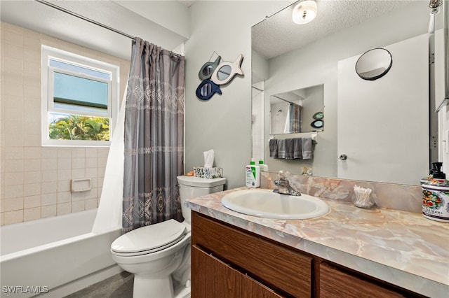 bathroom with shower / bath combo, a textured ceiling, toilet, and vanity