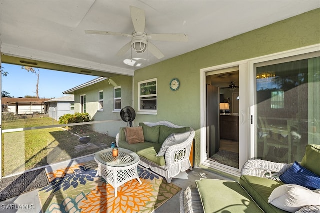 view of patio / terrace featuring a ceiling fan, outdoor lounge area, and fence