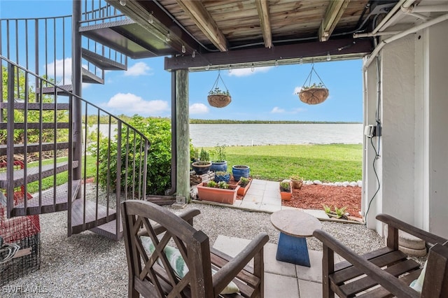 view of patio / terrace featuring a water view