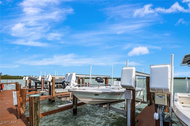 view of dock with a water view and boat lift