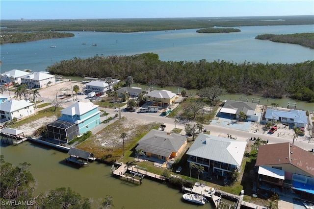 aerial view featuring a water view and a residential view