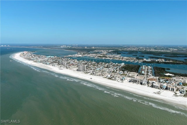 aerial view with a water view and a view of the beach